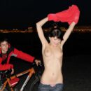 Girl Mila S on a bike completely undresses in the night city