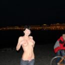 Girl Mila S on a bike completely undresses in the night city