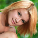 Her delectable coffee-colored complexion hinting a slight sheen, Violla’s exotic beauty and gorgeous, tight body stands out from the verdant surroundings of the countryside.