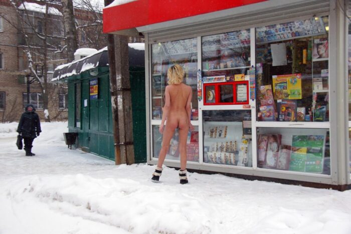 Naked blonde Diana tries to buy some goods at small shop