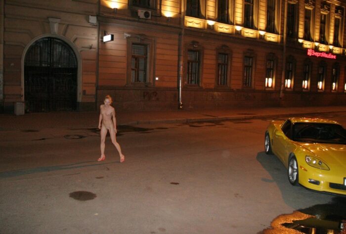 Naked blonde Vasilisa with sportcar at city center