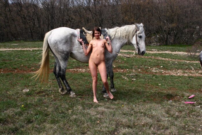 Russian girl Calla A with no clothes on the horse
