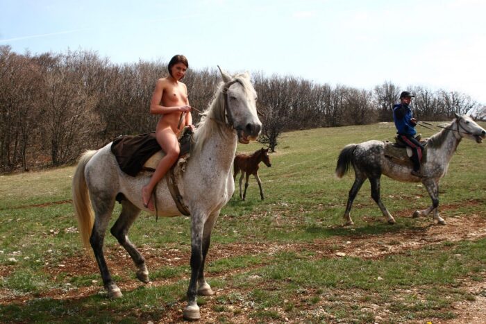Russian girl Calla A with no clothes on the horse