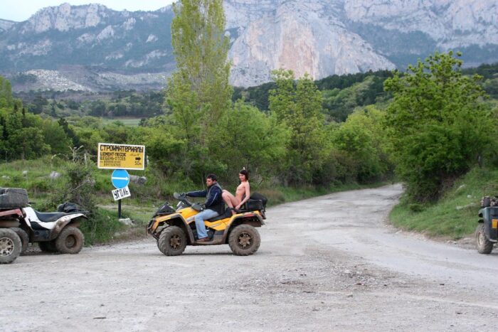 Russian girl Calla A without clothes is riding a quad