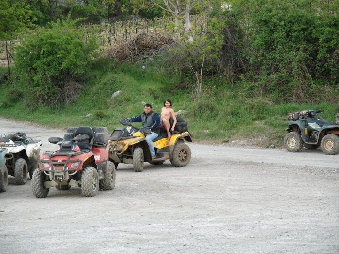 Russian girl Calla A without clothes is riding a quad