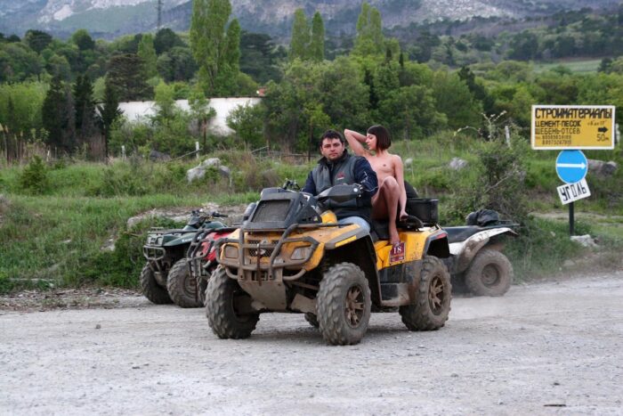 Russian girl Calla A without clothes is riding a quad