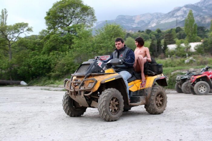 Russian girl Calla A without clothes is riding a quad