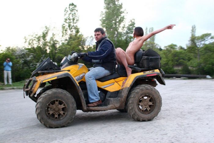 Russian girl Calla A without clothes is riding a quad