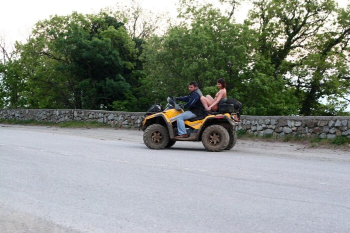 Russian girl Calla A without clothes is riding a quad