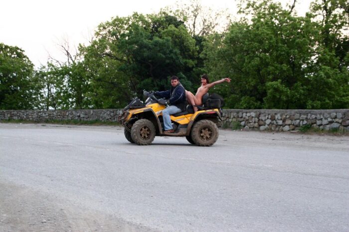 Russian girl Calla A without clothes is riding a quad