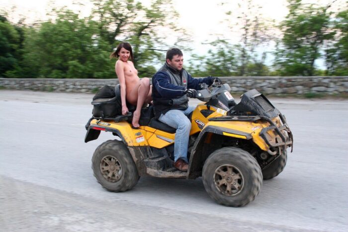 Russian girl Calla A without clothes is riding a quad