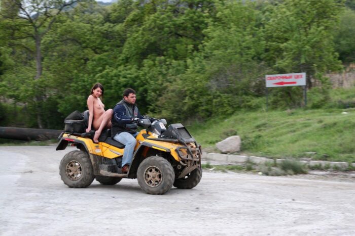 Russian girl Calla A without clothes is riding a quad