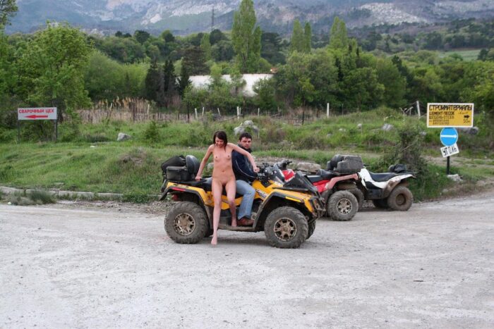 Russian girl Calla A without clothes is riding a quad