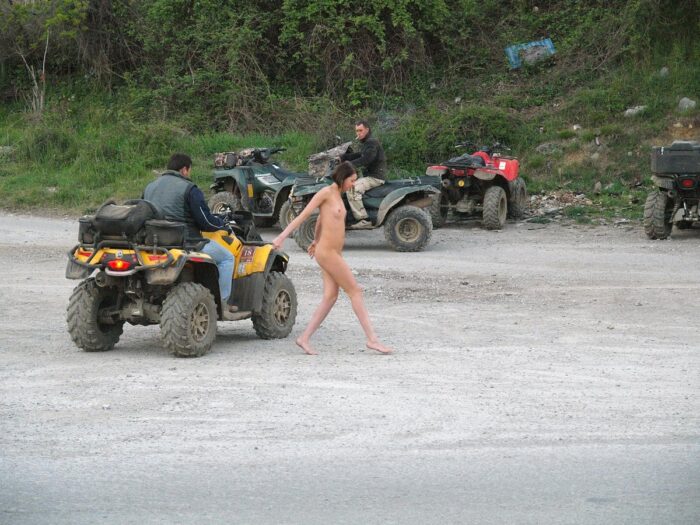 Russian girl Calla A without clothes is riding a quad