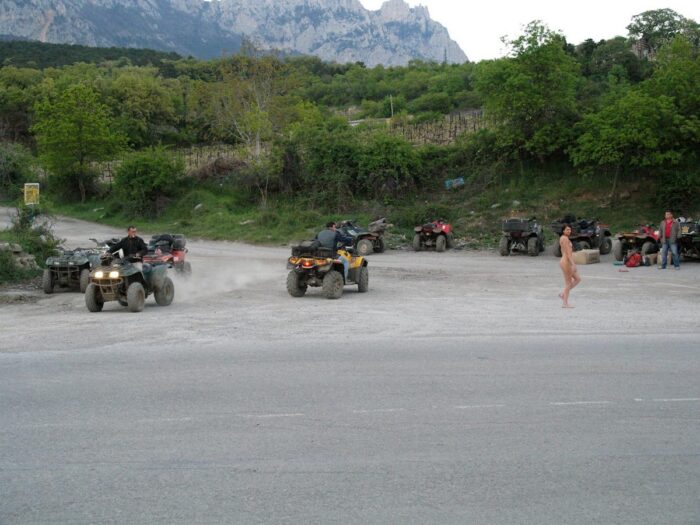 Russian girl Calla A without clothes is riding a quad