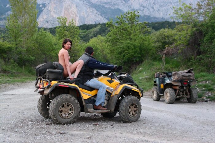 Russian girl Calla A without clothes is riding a quad