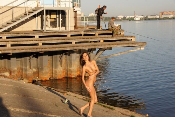 Russian girl Irina K without clothes by the city river