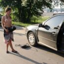 Young Vika D helps with a flat tire outdoors