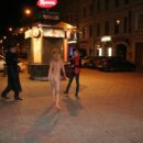 Blonde teen Vasilisa with sporty body flashes at night city