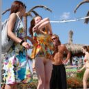 Completely naked girl Asja K on a walking street choosing souvenirs