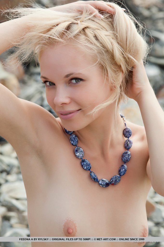 Feeona is a gorgeous sea nymph with a willowy physique. Her natural beauty stands out as poses naked against the azure sea and sky.