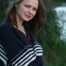 Mia poses so naturally on the elegant bed showcasing her innocent and cute face, and youthful, delectable body.