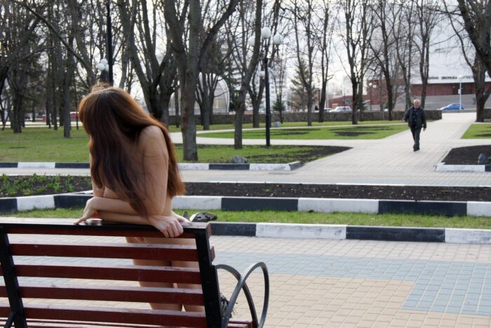 Naked girl Inna with great boobs on a bench in a city park