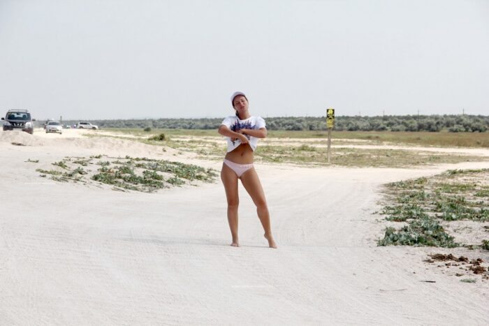 Russian girl Margarita S shows unshaven pussy on the sandy shore