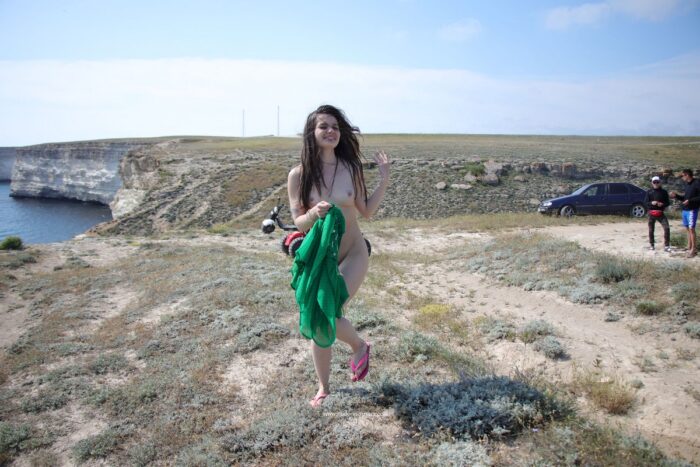 Russian teen brunette Vika K on the cliff