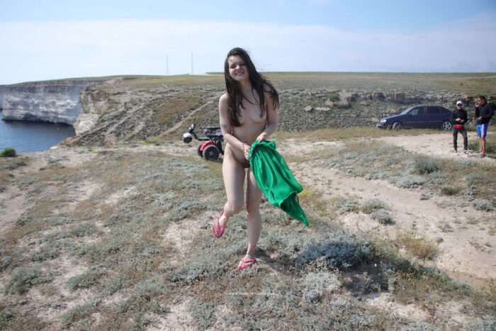 Russian teen brunette Vika K on the cliff