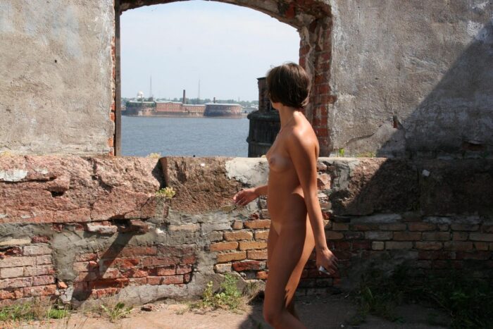 Short-haired russian babe Anna S posing naked at an old fort