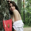 Very hot brunette Dayana with gorgeous body posing in forest