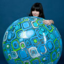 Without any trace of makeup, Zelda`s natural beauty stands out, baring her nubile body as she playfully poses with a large beach ball.