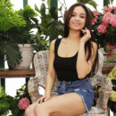 Astrid Herrara is in the greenhouse when she removes her shorts and pull up her shirt and frees her huge hooters. She fondles her hairless pussy and squeezes her plump booty.