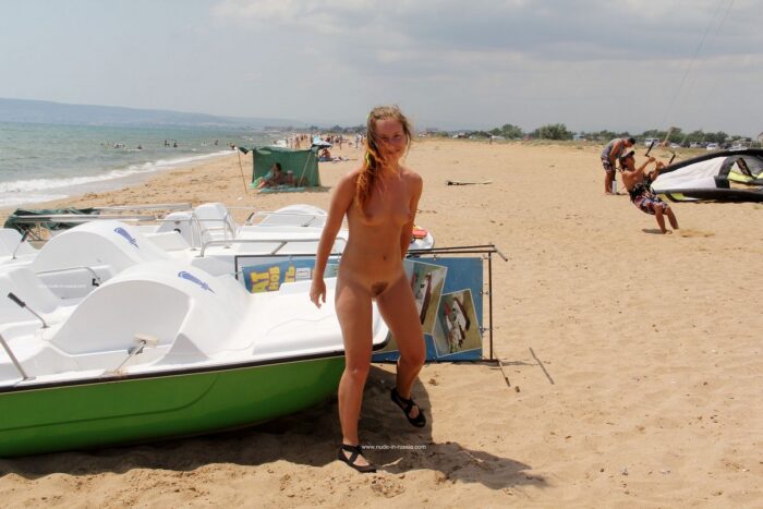 Girl Margarita S with unshaved pussy on a public beach