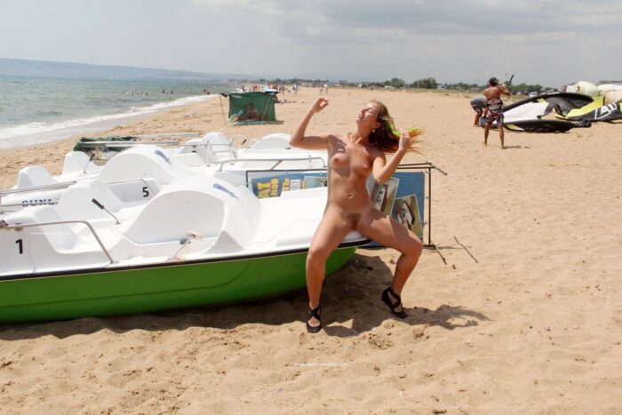 Girl Margarita S with unshaved pussy on a public beach