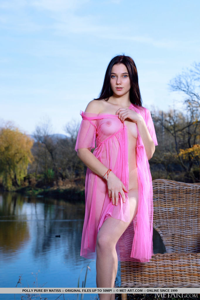 Polly Pure exudes radiance in her pink sheer cover up by the calm waters of the lake. She takes it off and flashes her flawless skin and smooth pinkish kitty. 