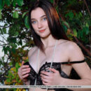 Polly Pure seduces and teases in her black sexy lingerie and long pearl necklace. She slip out of it and uncover her long flawless slender physique and shaved clit.