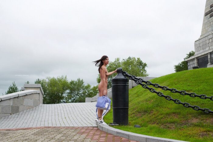 Russian brunette Naden walks naked at public park