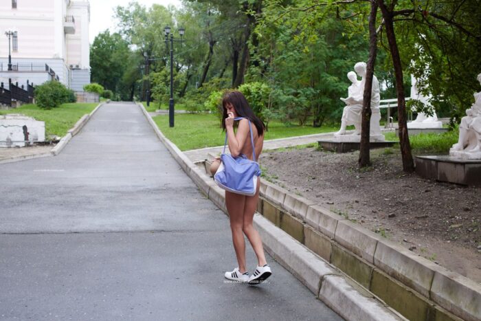 Russian brunette Naden walks naked at public park