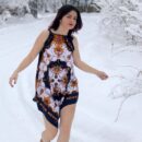 Russian girl Karolina plays with a snow outdoors