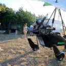 Two naked girls learn to fly on a gyroplane