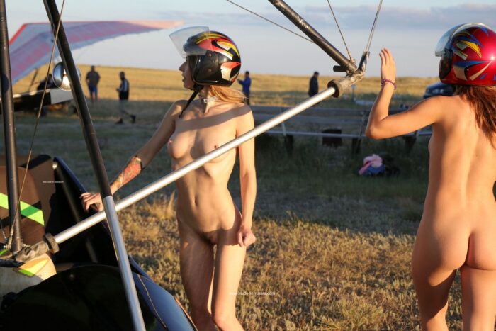Two naked girls learn to fly on a gyroplane