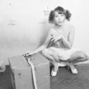 Lovely russian girl Masha posing with an old vacuum cleaner