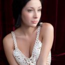 Night A is incredibly sexy while laying on red velvet