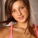 Wearing stylish pink stiletto sandals matching her pink top and skirt, Melena’s girlish beauty with womanly allure can make any man down to his knees.