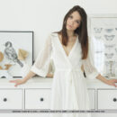 Adriana Fawn takes off her white dainty robe and uncovers her slender fit body and shaved moist pinkish pussy.