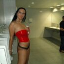 Brunette Julia P removes panties in the male toilet