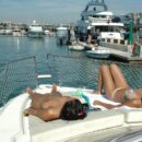 Fully naked girl Julia P walks along the city port