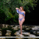 Hailey looks super hot in her ruffled two-piece bikini. She strips it off on the river and exposes her slender bod, big pinkish nipples and smooth cunt.